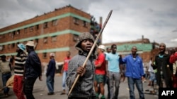 Zulu protesters demonstrate against foreign migrants outside their hostel in the Jeppestown district of Johannesburg, South Africa, April 17, 2015.