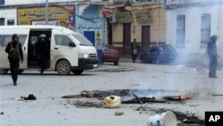 Police patrol in a street in Tunis, Jan. 13, 2011.