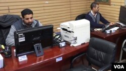 Travel agent Waddah Mubarez (right) says bookings among Yemenis have been down by more than 50% over the past year. But his biggest concern is being separated from his mother, who cannot travel to the United States due to travel restrictions placed on Yem