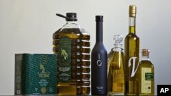 Extra virgin olive oil bottles are displayed in a specialized shop in the center of Madrid, July 29, 2005. 