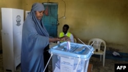 FILE - A woman casts her ballot in the Presidential election at a polling station in Hargeisa, Somaliland, Nov. 13, 2017. Protests have followed the election, with one opposition party claiming "massive" polling irregularities.