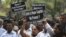 Indian protesters hold placards during a protest to demand for tougher rape laws and better police protection for women, outside the Parliament in New Delhi, India, April 22, 2013.
