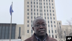 Reuben Panchol is shown Dec. 6, 2019, at the North Dakota state capitol in Bismarck. Panchol, who immigrated from Sudan to North Dakota as a child, says he hopes to tell his personal story at a meeting Monday, Dec. 9.