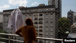 Venezuelan immigrant Jhannela Brito is seen in her apartment after softening immigration requirements for Venezuelans, in Buenos Aires, Argentina, Feb. 20, 2018.