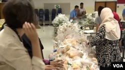 FILE - The Foundation for Appropriate and Immediate Temporary Help (FAITH) has conducted a food drive in Herndon, Virginia, every week during Ramadan for the past nine years. 