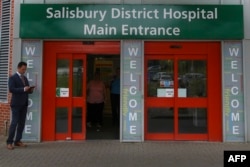 FILE - A general view shows the main entrance to Salisbury District Hospital, in Salisbury, southern England, July 04, 2018, where a British woman, Dawn Sturgess, poisoned with a nerve agent, died Sunday.