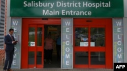 FILE - A general view shows the main entrance to Salisbury District Hospital, in Salisbury, southern England, July 04, 2018, where a British woman, Dawn Sturgess, poisoned with a nerve agent, died Sunday. 