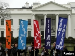 Opponents of the Trans Pacific Partnership (TPP) trade agreement protest outside the White House in Washington, Feb. 3, 2016.