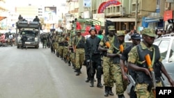 FILE - UPDF soldiers and police forces patrol streets in Kampala after the US embassy in Uganda warned of a "specific threat" by an unknown group to attack Entebbe international airport, July 3 2014.