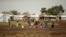 In this photo taken Oct. 24, 2017, South Sudanese refugees are seen at the Nguenyyiel refugee camp during a visit by U.S. Ambassador to the United Nations Nikki Haley to Gambella region, Ethiopia.