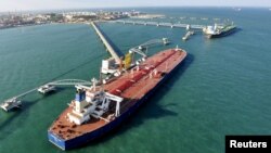 FILE - A crude oil importing port in Qingdao, Shandong province, China.