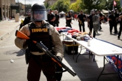 A trooper stands outside the BOK Center where President Donald Trump will hold a campaign rally in Tulsa, Okla., June 20, 2020.