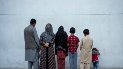 Najia, second left, pose with her family in Kabul, Afghanistan, Oct. 1, 2021. Soon after the Taliban took control of Kabul, the family sold their households and used the money to try to cross into Pakistan.