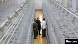 FILE - In this photo released by the Korean Central News Agency, North Korean leader Kim Jong Un tours the Nuclear Weapons Institute at an undisclosed location in North Korea, Sept. 13, 2024. Some in Seoul say South Korea should have the right to reprocess spent nuclear fuel.