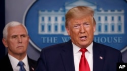 President Donald Trump, joined by Vice President Mike Pence, speaks about the coronavirus in the press briefing room at the White House, Feb. 29, 2020, in Washington. 