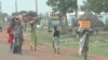Residents of the South Sudanese town of Bentiu flee toward the U.N. base after fresh fighting and targeted killings rocked the town.