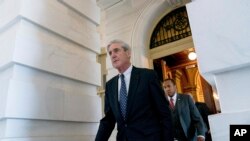 FILE - Special counsel Robert Mueller, in charge of investigating Russian interference in the 2016 U.S. presidential election and possible collusion between Moscow and the Trump campaign, departs Capitol Hill, in Washington, June 21, 2017, following a clo