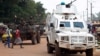 Police officers from the United Nations Multidimensional Integrated Stabilization Mission in the Central African Republic (MINUSCA) in an armored vehicle patrol a market in Bangui's Combattant district, Sept. 14, 2015.