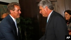 Sen. Jeff Flake, R-Ariz, shakes hands with Cuba's First Vice President Miguel Diaz-Canel, at Revolution Palace, in Havana, Cuba, June 13, 2015.