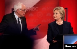 Democratic presidential candidate Senator Bernie Sanders and former Secretary of State Hillary Clinton spar during a presidential primary debate at the University of New Hampshire in Durham, Feb. 4, 2016.