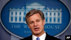 FILE - FBI Director Christopher Wray speaks during the daily press briefing at the White House, Aug. 2, 2018, in Washington.