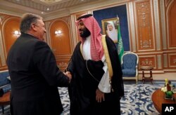 U.S. Secretary of State Mike Pompeo shakes hands with the Saudi Crown Prince Mohammed bin Salman in Riyadh, Saudi Arabia, Oct. 16, 2018.