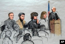 FILE - In this courtroom sketch, Boston Marathon bombing suspect Dzhokhar Tsarnaev, third from right, is depicted with his lawyers and U.S. District Judge George O'Toole Jr. at the federal courthouse in Boston, Jan. 6, 2015.