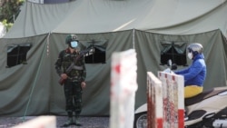 FILE - A military checkpoint is seen during lockdown amid the COVID-19 pandemic in Ho Chi Minh, Vietnam, August 23, 2021.