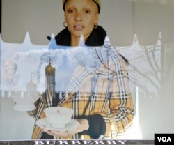 The Kremlin is reflected in a GUM Department store window display in Moscow. (Photo: Jamie Dettmer / VOA)