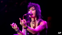 Joan Jett of Joan Jett and the Blackhearts performs at the Harley-Davidson 110th Anniversary celebration, Aug. 29, 2013 in Milwaukee, WI.