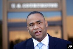 U.S. Rep. Marc Veasey, D-Texas, talks to the media outside of the U.S. Courthouse, Monday, July 14, 2014, in San Antonio.