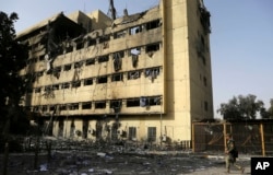 An Iraqi soldier patrols by al-Salam hospital in Mosul, Iraq, Jan. 10, 2017. The Mosul hospital was left all but gutted by the battle to retake it.