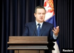 Serbian Foreign Minister Ivica Dacic gestures during a news conference in the West Bank town of Bethlehem Jan. 6, 2017.