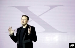 FILE - Elon Musk, CEO of Tesla Motors Inc., introduces the Model X car at the company's headquarters on Sept. 29, 2015, in Fremont, Calif.