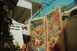 Atreyu Moniaga bersama karya lukisannya (dok: Atreyu Moniaga)