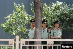 Paramilitary officers keep watch in Tiananmen Square in Beijing, China,June 4, 2019.