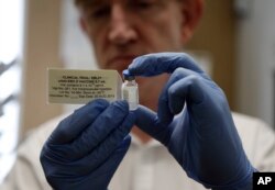 FILE - A vaccine against Ebola, developed by the Public Health Agency of Canada, proved effective in human trials, giving public health officials hope to confront the next outbreak.