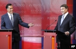 Former Massachusetts Governor Mitt Romney makes a point as Texas Governor Rick Perry (R) listens during the Reagan Centennial GOP presidential primary debate at the Ronald Reagan Presidential Library in Simi Valley, California September 7, 2011