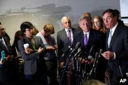 Senate Intelligence Committee Vice Chairman Sen. Mark Warner (R), accompanied by committee Chairman Sen. Richard Burr speak to the media on Capitol Hill in Washington, May 11, 2017.