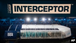 he Interceptor, a new garbage-collecting floating device is moored at a dock in Rotterdam, Netherlands, Saturday, Oct. 26, 2019.