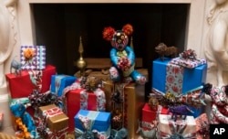 Decorations in front of the fireplace in the Vermeil Room at the White House on Dec. 2, 2015, in Washington as Christmas decorations for 2015 are unveiled.