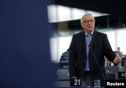 FILE - European Commission President Jean-Claude Juncker delivers a speech during a debate on the future of Europe at the European Parliament in Strasbourg, France, May 30, 2018. Juncker on May 31 called U.S. tariffs on steel and aluminum imports "unjustified."