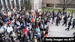 FILE - Tamika Palmer, mother of Breonna Taylor and others lead a memorial march for Breonna Taylor near Jefferson Square Park on March 13, 2021 in Louisville, Kentucky.