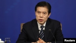 Chinese Commerce Minister Zhong Shan attends a news conference on the sidelines of the National People's Congress in Beijing, China, March 11, 2018.