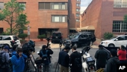 FILE - Reporters are seen during a stake-out in Washington, D.C., May 16, 2019. 