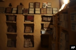 Books line the shelves of one of the libraries in Chinguetti, Mauritania, Feb. 3, 2025.
