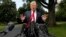 President Donald Trump speaks to the media on the South Lawn of the White House in Washington, May 23, 2018, en route to a day trip to New York. 