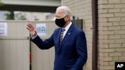 Democratic presidential candidate, former Vice President Joe Biden waves as he arrives to meet with with small business owners, Wednesday, June 17, 2020, at Carlette's Hideaway, a soul food restaurant, in Yeadon, Pa. (AP Photo/Matt Slocum)