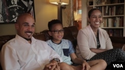 Jeremy Randall and Ariam Mohamed are experiencing their first Ramadan together as newlyweds. Jeremy's son, Jeremiah, 10, is not Muslim. He says he tries not to tempt them during their fasts. (B. Ayoub/VOA)