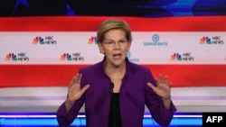 FILE - Democratic presidential hopeful Massachusetts Senator Elizabeth Warren participates in the first Democratic primary debate of the 2020 presidential campaign at the Adrienne Arsht Center for the Performing Arts in Miami, June 26, 2019.